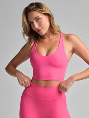 ComfrtCore™ V-Neck Crop Tank: Tyler is 5'9" and wears a size XS