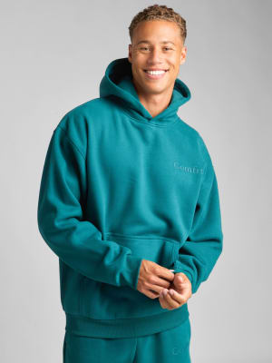 Minimalist Hoodie: Evan is 6ā²4ā³ wearing a size M