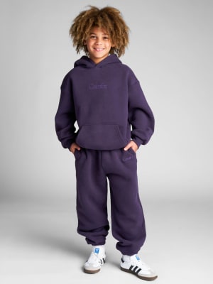 Signature Kids Sweatpants: Logan is 8 wearing a size S