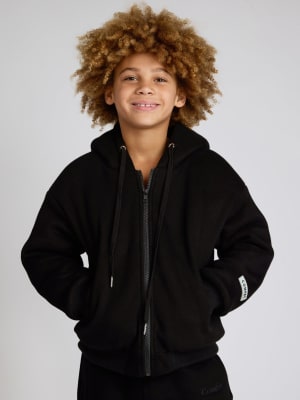 Weighted Kids Hoodie: Logan is 8 wearing a size S