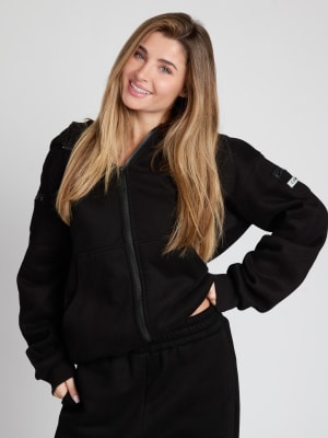 Travel Essentials Zip Hoodie: Serena is 5'7" and wears a size M