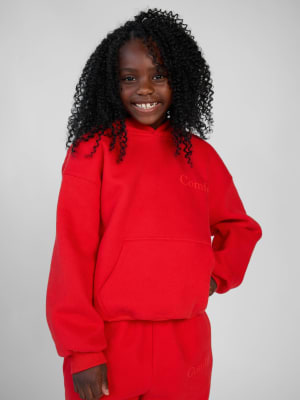 Minimalist Kids Hoodie: Hattie is 7 wearing a size S