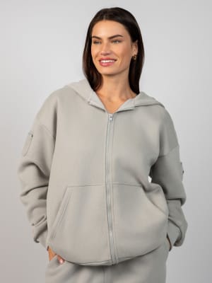 Travel Essentials Zip Hoodie: Lauren is 5'8" and wears a size M