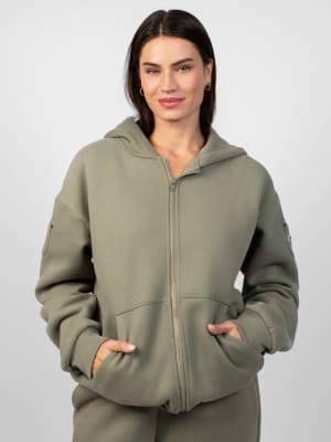 Travel Essentials Zip Hoodie: Lauren is 5'8" and wears a size M