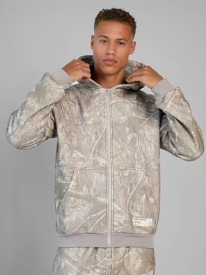 Camo Zip Hoodie: Evan is 6'4" wearing a size L