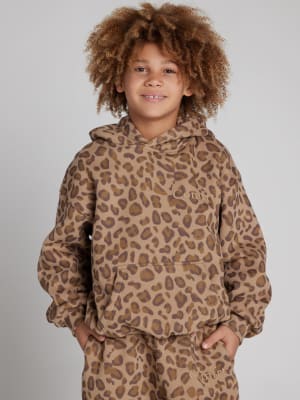 Minimalist Kids Hoodie: Logan is 8 wearing a size S