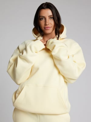 Minimalist Hoodie: Sara is 5'6" and wears a size M
