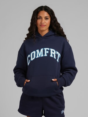 Varsity Hoodie: Elly is 5'8” and wears a size S