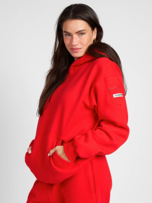 Travel Essentials Hoodie: Lauren is 5'8" and wears a size M