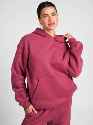 Travel Essentials Hoodie: Lauren is 5'8" and wears a size M