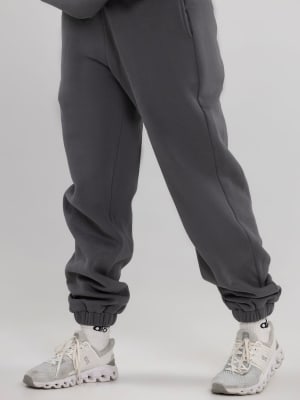Travel Essentials Sweatpants: Shubangi is 5β²6β³ and wears a size M