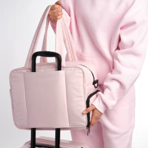 Pink bag with a luggage sleeve